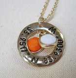 Gold tone necklace with U.T. latitude and longitude