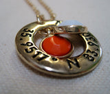Gold tone necklace with U.T. latitude and longitude