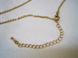 Gold tone necklace with U.T. latitude and longitude